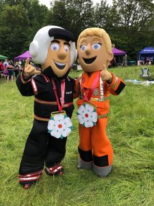 Image of Percy and Polly with the medals after the 2019 Run for Jo Mascots' Race