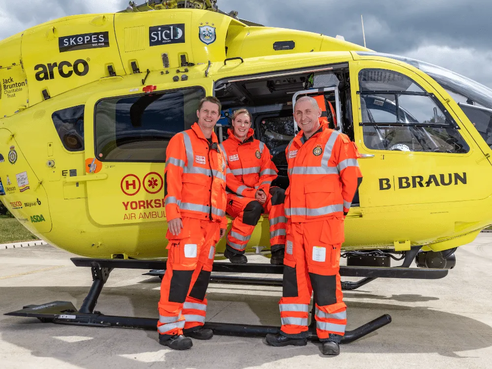 Crew in front of the YAA Helicopter