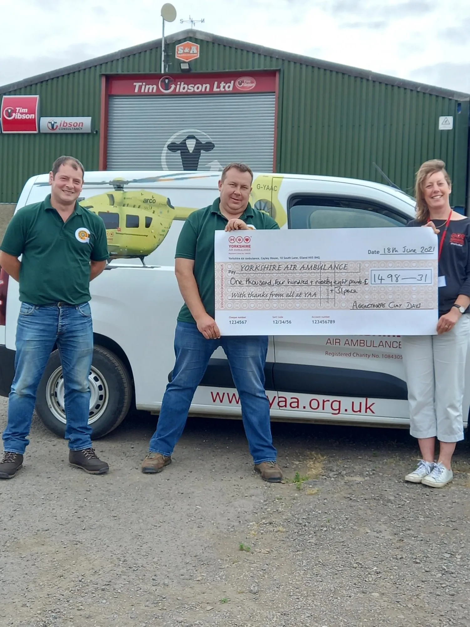 Agglethorpe Charity Clay Day staff with a cheque for the YAA