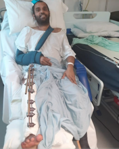 Photo of Imran Choudhury in a hospital bed