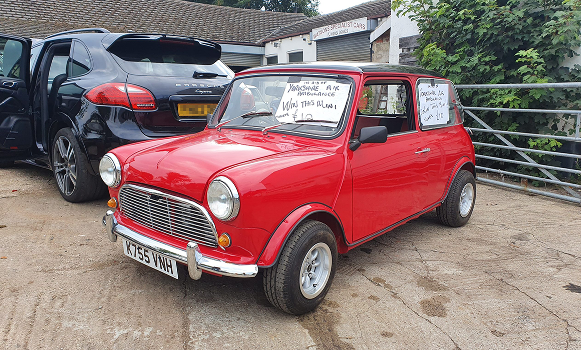 Photo of a red Mini Cooper car that is being raffled in aid of Yorkshire Air Ambulance