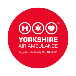 A red circle with the white Yorkshire Air Ambulance logo in the middle.