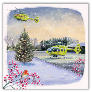 A wintery image of two yellow Yorkshire Air Ambulance helicopters. Once is on the ground and the other is in the air. There is a large Christmas tree with lights on and there is snow on the ground. In the foreground there is a robin sat on a branch full of red berries.