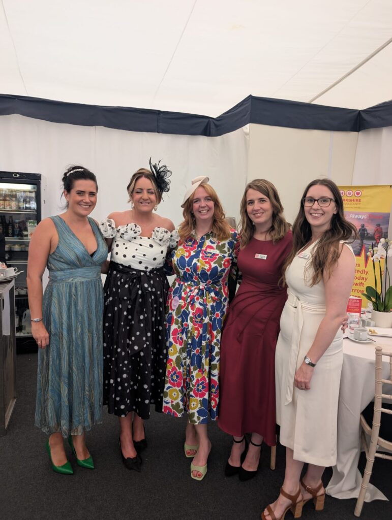 5 ladies dressed for a day at the races