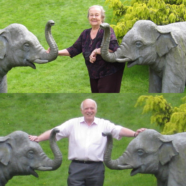 Two images, one of a lady wearing a dark coloured top and trousers, standing between two statues of elephants. The other is a man wearing a light coloured short sleeved shirt and dark grey trousers, standing between the same elephant statues.